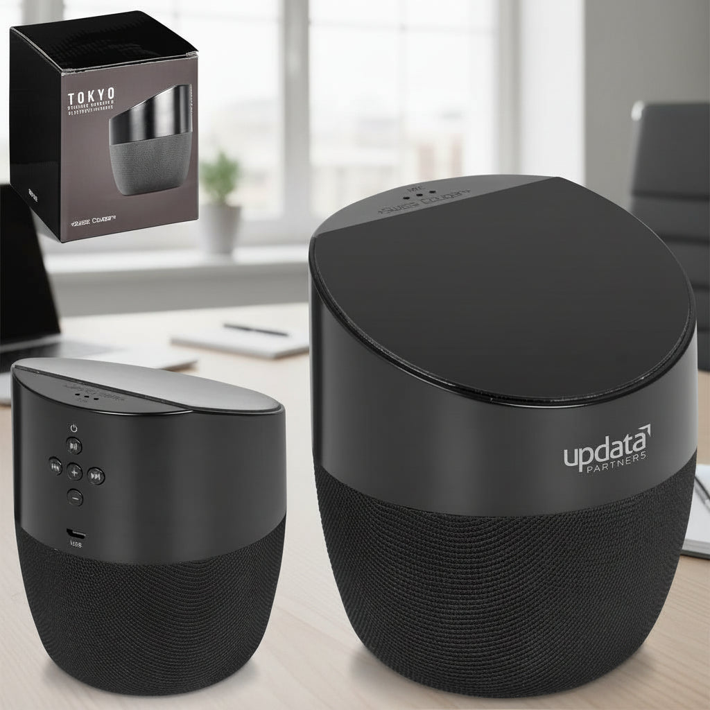 Black speaker with 'updata partners' branding and packaging on a white background