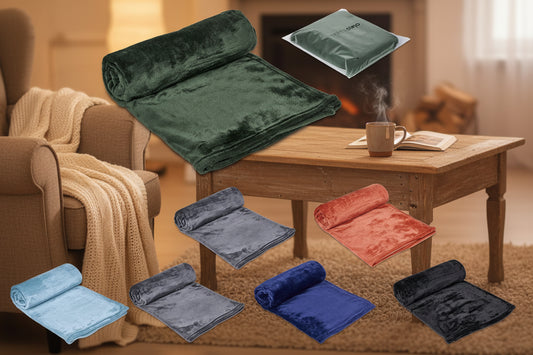 Collection of folded towels in various colors with packaging on a white background